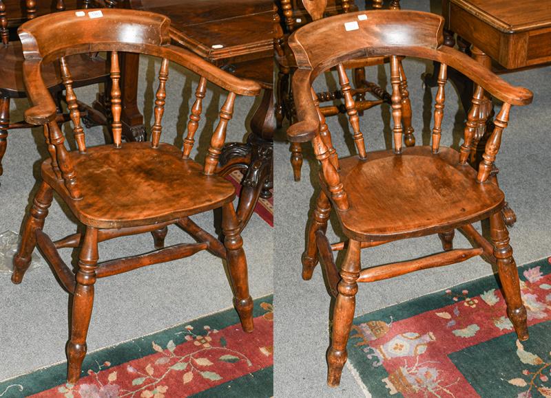 A pair of 19th century yew wood smokers chairs with twin stretchers and turned supports (2)0
