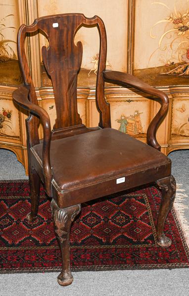 A 19th century style mahogany open armchair on shell carved legs and pad feet