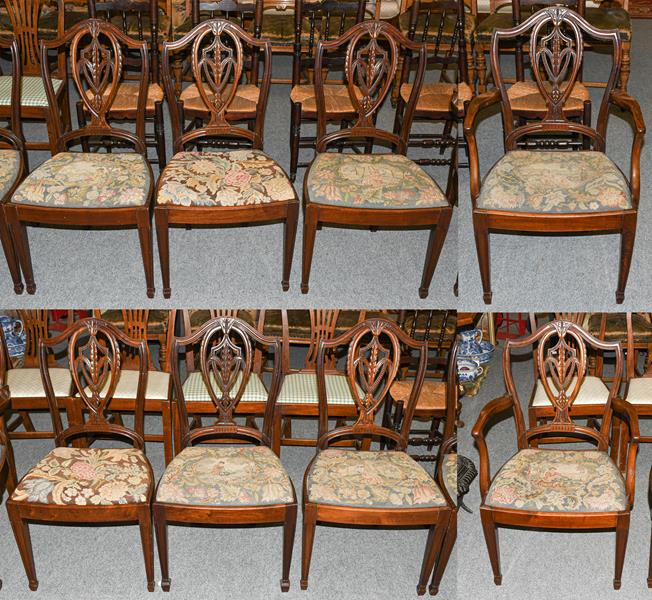 A set of nine mahogany Hepplewhite style dining chairs including two carvers