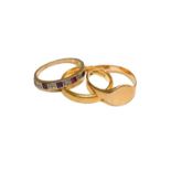 A 22 carat gold band ring, finger size M1/2, an 18 carat gold signet ring, out of shape, and a 9