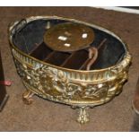 A Salters spring balance and an embossed brass planter of ovoid form, later fitted, 60cm wide (2)