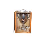 A silver plate tea urn, probably late 19th/early 20th century, vase shaped and on four bun feet,