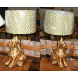 A pair of gilt wood temple dragon table lamps with shades, 32cm high (without shades)