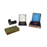 A tray of assorted collectables including a live steam tank engine, two cased bronze medical