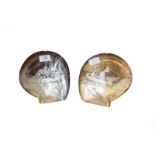 A pair of 19th century mother-of-pearl carved shells, depicting a lady shooting and fishing, both