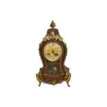 A 19th century French boulle cased mantel clock striking on a bell with gilt mounts, enamel dial