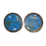 A pair of Japanese Meiji period cloisonne chargers, with blue ground decorated with cranes and