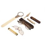 A selection of collectors items, including a magnifying glass/ivory letter opener, silver