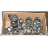 A quantity of 19th century pewter measures and a flagon (one box)