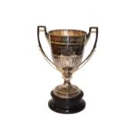 A George V silver trophy cup, by Henry Atkin, Sheffield, 1926, tapering cylindrical and on spread