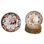 A Royal Crown Derby part dessert service, Imari pattern including eight plates 22cm diameter,