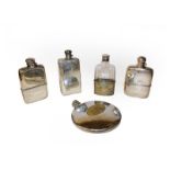 Five silver plated spirit flasks, one incorporating a cigarette case (one tray)