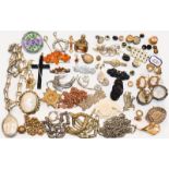 A quantity of costume jewellery, including: a silver locket on chain, various other chains,