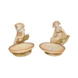 A pair of Royal Worcester comports, modelled as a girl and a boy, puce marks, 21cm . Male figure