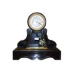 A Victorian black slate striking mantel clock