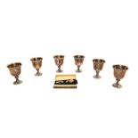 Six silver egg cups and a pair of 9 carat gold and silver cufflinks (cased)