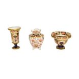 Three Royal Crown Derby vases, one with twin handles, a pedestal vase and another, all in the