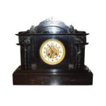 A Victorian slate and marble eight day mantel clock, together with an Edwardian inlaid mahogany