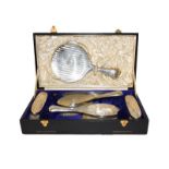 A cased George V silver dressing table service, by William Hutton and Sons, Birmingham, 1913 and