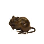 A Japanese bronze model of a rat feeding on a nut, 16cm (a.f.). Tail repaired.