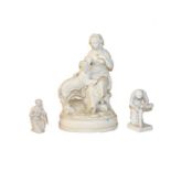A Victorian parian figure of a seated lady and a dog, 36cm, together with two similar smaller