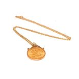 A gold full sovereign mounted in a 9 carat gold setting and attached with a chain with clasp stamped