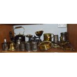 Pewter tankards, brass hand bells, scales, brassware, etc (one shelf)