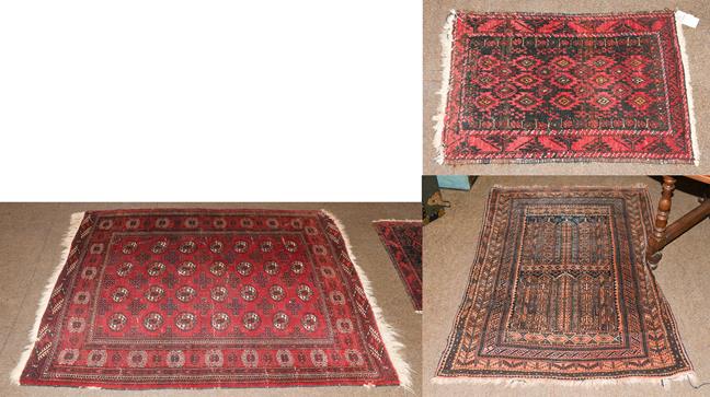 An Afghan Tekke rug, the crimson field with four rows of güls enclosed by octagon borders, 163cm