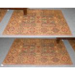 A matched pair of machine made Laura Ashley rugs, each of 17th century Transylvanian design, 192cm