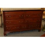 A George III mahogany Lancashire chest, with fluted corner columns and raised on ogee bracket