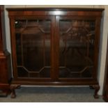 A Chippendale style mahogany bookcase, twin glazed door, ball and claw feet, 122cm by 37cm by 122cm