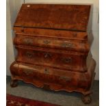 A reproduction burr walnut and cross banded Bureau in the Dutch style, with full fitted interior,