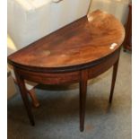 A George III mahogany demi lune foldover tea table, 94cm by 46cm by 74cm