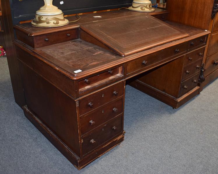 A leather top desk with bureau top, 152cm by 80cm by 84cm