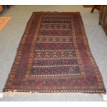 Baluch Soumakh rug, the field with indigo and burgundy bands of tribal devices enclosed by borders