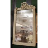 A 19th century bevelled mirror white painted mirror frame with floral surmount, 85cm by 160cm