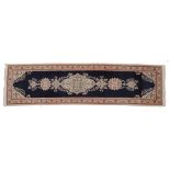 Narrow Tabriz Runner North West Iran, circa 1950 The plain deep indigo field with ivory floral