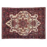 Good Malayer Rug West Iran, circa 1900 The cream field of large angular tendrils around a stellar