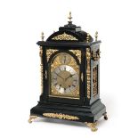 A Victorian Ebonised and Gilt Metal Mounted Chiming Table Clock, circa 1890, arched pediment with