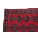 Ushak Carpet West/Central Anatolia, circa 1920 The tomato red field with three rows of medallions