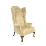 An Oversized Queen Anne Style Armchair, late 19th/early 20th century, recovered in cream cut velvet,