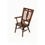 A George III Fruitwood and Elm Mendlesham Armchair, early 19th century, the ball surmounted and