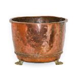 A Brass and Copper Log Bin, 19th century, of circular form with everted rim, on paw feet, 54cm