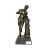 After the Antique: A Bronze Figure of Silenus, standing beside a tree trunk holding Bacchus as a