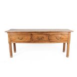 An 18th Century French Provincial Ash Low Dresser, the rectangular top of three plank construction