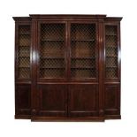 A Mahogany and Crossbanded Breakfront Bookcase, the upper section with brass grille doors