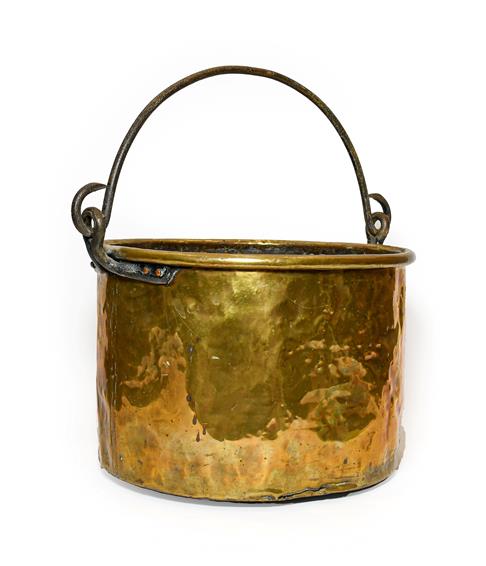 A Brass Log Bin, possibly Irish, 18th/19th century, of circular form with rolled rim and iron