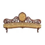 A Victorian Carved Walnut Eight Piece Salon Suite, circa 1870, recovered in floral gold silk,