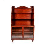 A Victorian Mahogany Waterfall Glazed Bookcase, mid 19th century, the arched pediment above