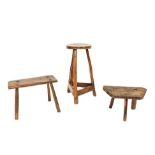 Three Primitive Stools, comprising an early 19th century oak rectangular example of peg